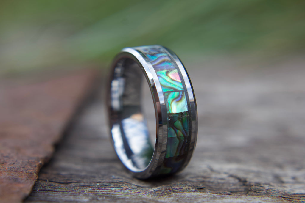 Tungsten silver coloured ring, with abalone inlay which is green in colour