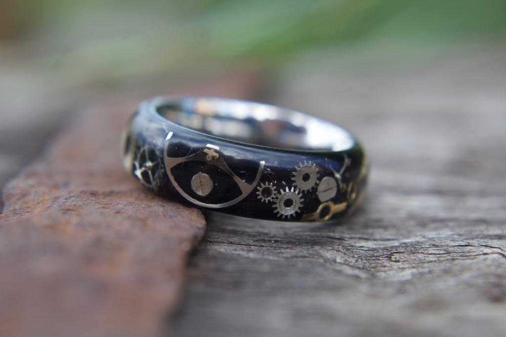 Stainless steel ring with watch parts and resin for 3d look