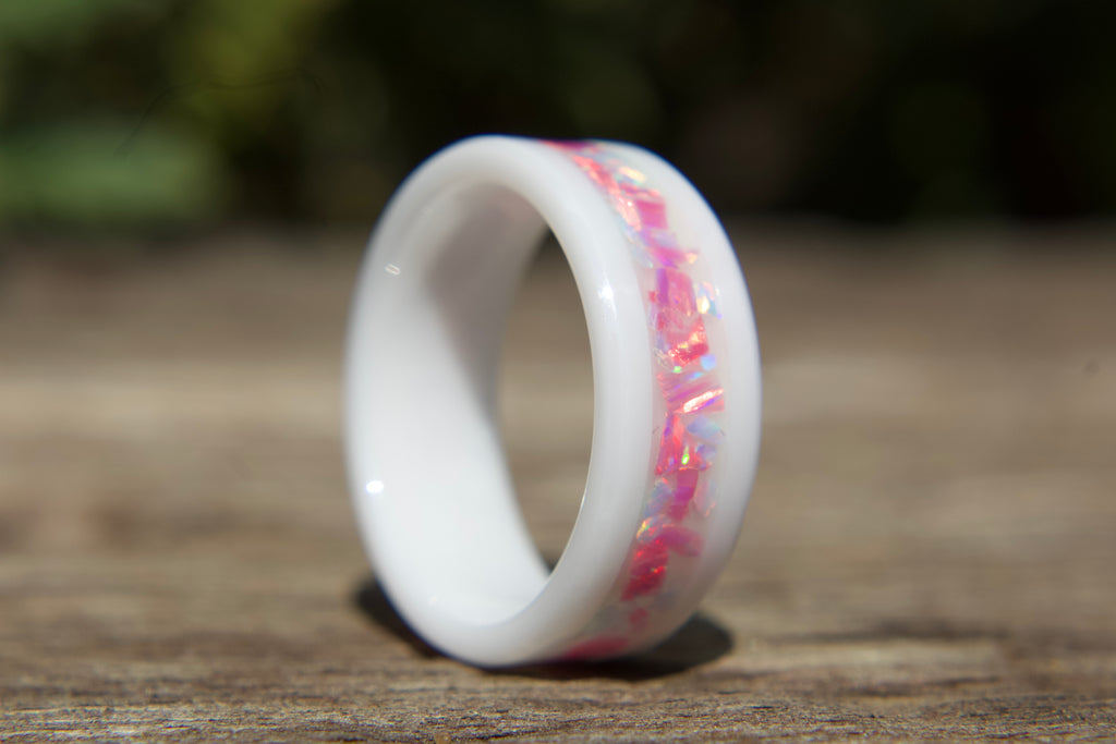 White ceramic ring with pink opals that look broken