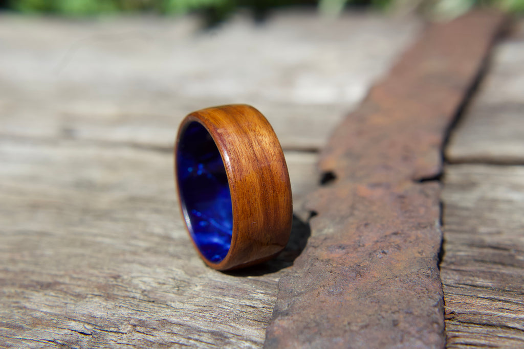 Wood bentwood ring brown in colour with a bright blue celluloid core lining