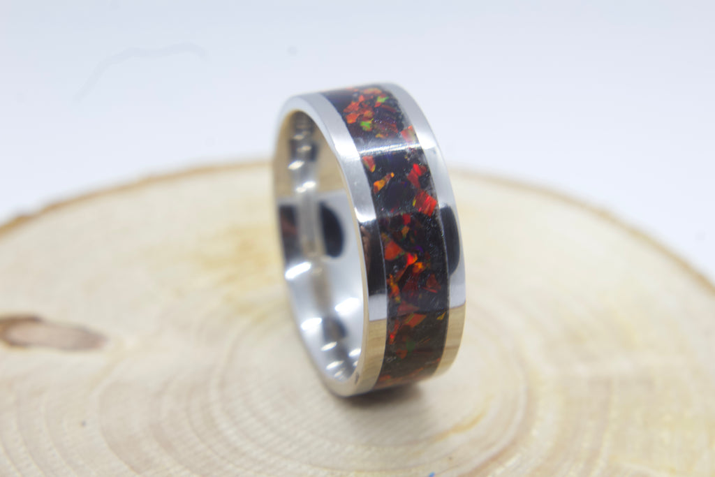 Red fire inlay ring set with fire red opals and black mica background