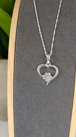 Load image into Gallery viewer, Paw Print Hollow Heart Pendant
